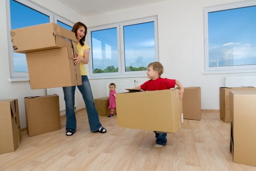 Local removals team handling furniture in a Spitalfields property
