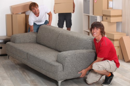 Furniture and boxes being loaded into a van in East London