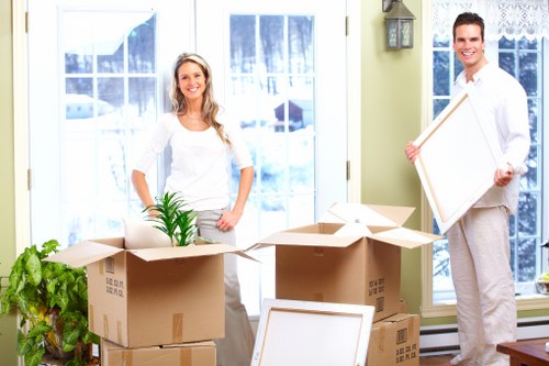 Local moving team handling boxes and household items