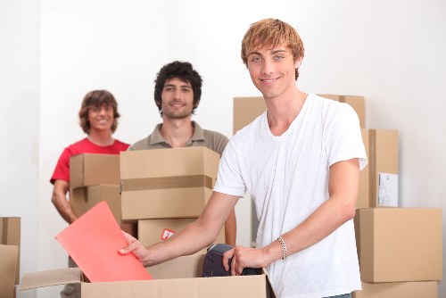 Packed office boxes and IT items ready for transport from a Spitalfields workspace