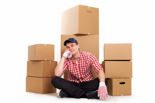Furniture collection team handling bulky items in an East London property